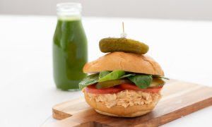 Tuna Dill Pickle Sandwich topped with a fresh pickle slice