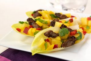 3 endive leaves filled with Smoked Oysters and Pineapple-Mango Salsa