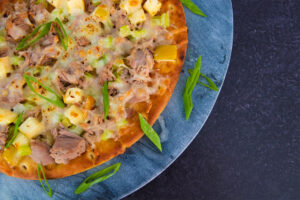 A plate of Tuna Apple Melt on a Greek pita