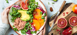 Colourful salad bowl with avocado and blood oranges