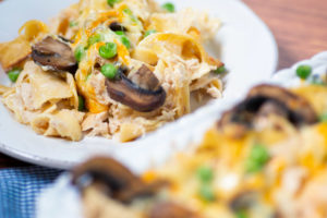 Close up of plated Classic Tuna Noodle Casserole with mushrooms and peas