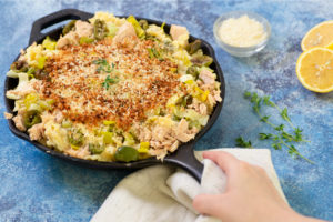 Modern Low Carb Tuna Casserole in a skillet with lemon on the side